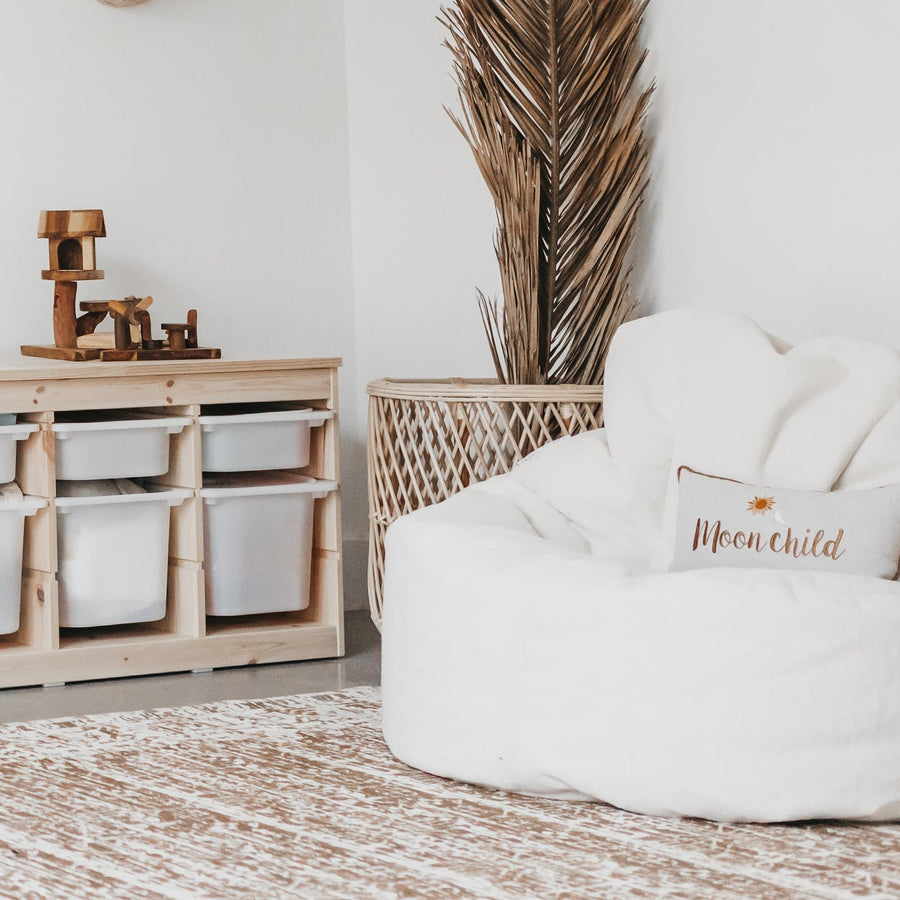 Plush lounger bean bag with a back, sitting neatly in a small room